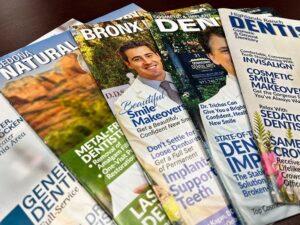 A selection of Custom Dental Magazines that Gilleard Dental Marketing produces